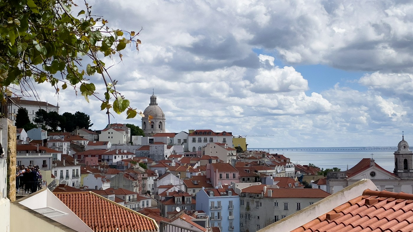 Terracotta rooftops and waterfront views in Lisbon, Portugal